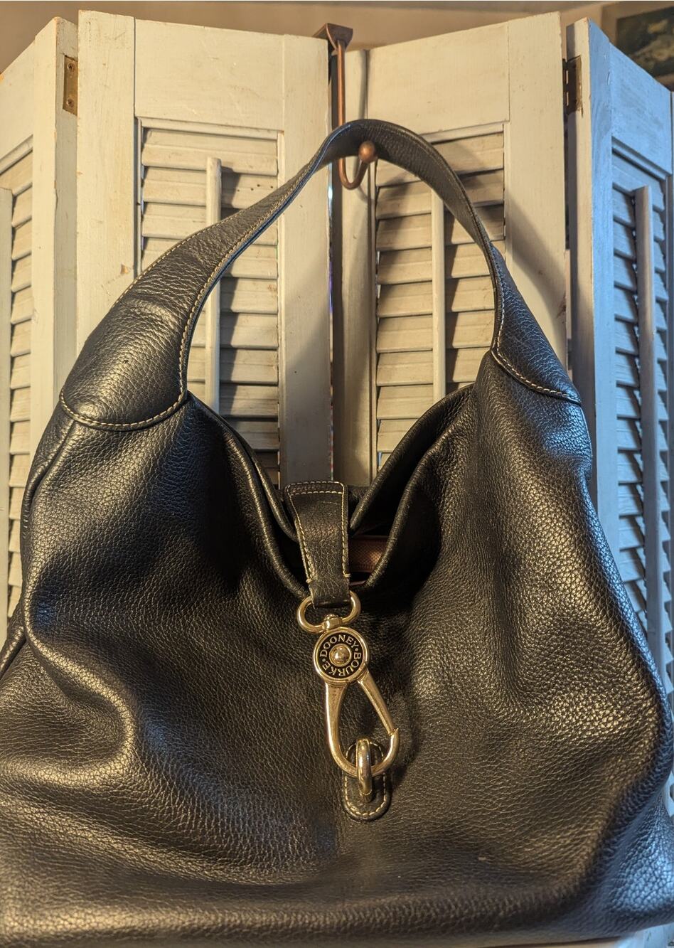 Dooney & Bourke black pebbled leather logo lock hobo bag